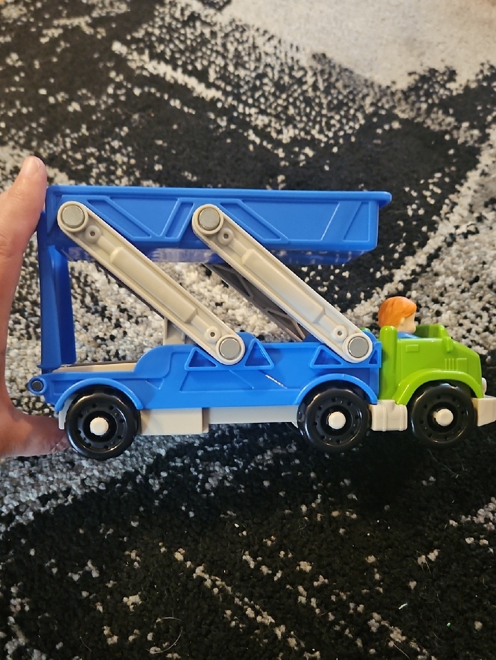 Fisher-Price Little People Ramp 'n Go Carrier featuring a blue transporter truck
